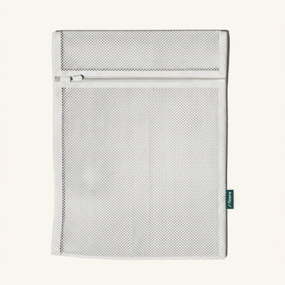 Flowra Premium Wash Bag — mesh laundry bag with zip closure and Flowra logo tag